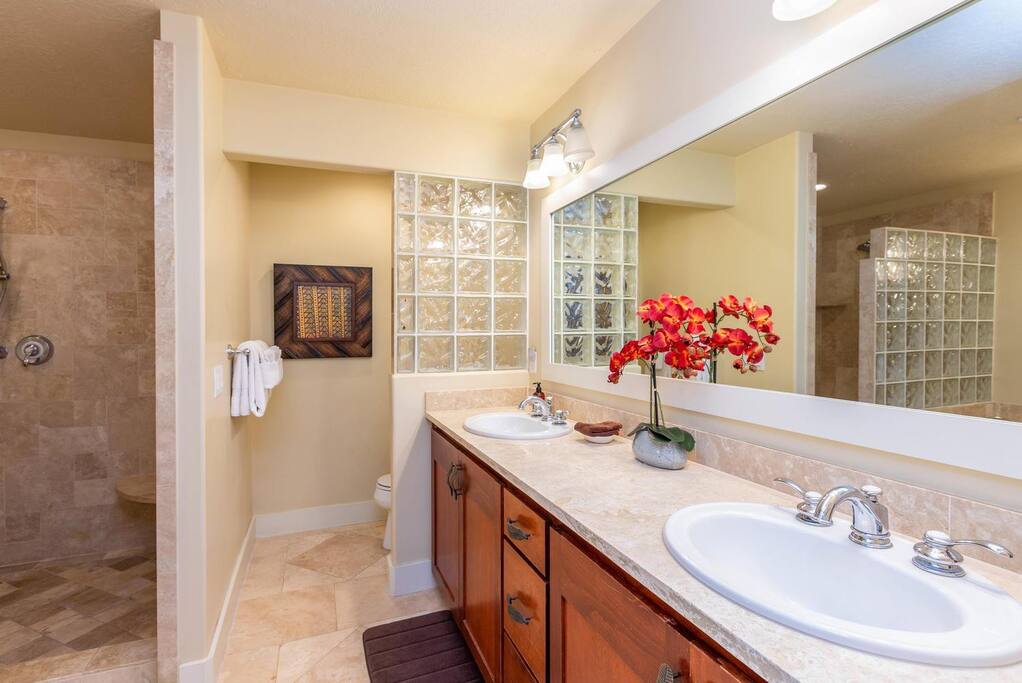 Luxurious Kauai Villas bathroom featuring a double sink and shower.